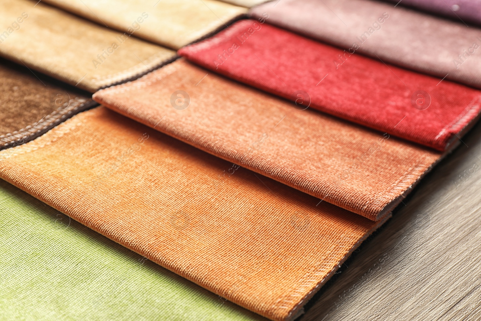 Photo of Fabric samples of different colors for interior design as background