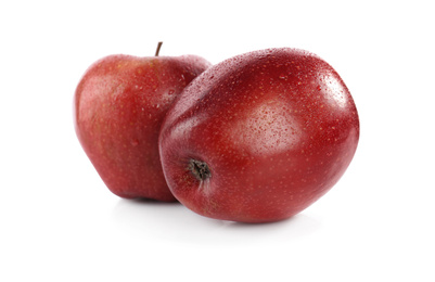 Photo of Fresh juicy red apples with water drops isolated on white