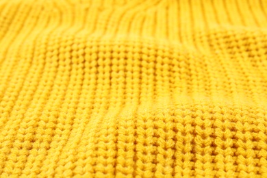 Photo of Texture of cozy warm sweater as background, closeup