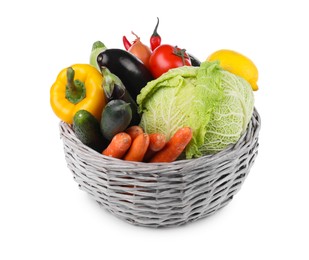 Photo of Wicker basket with fresh ripe vegetables and fruit on white background