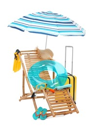 Photo of Deck chair, umbrella, suitcase and beach accessories isolated on white