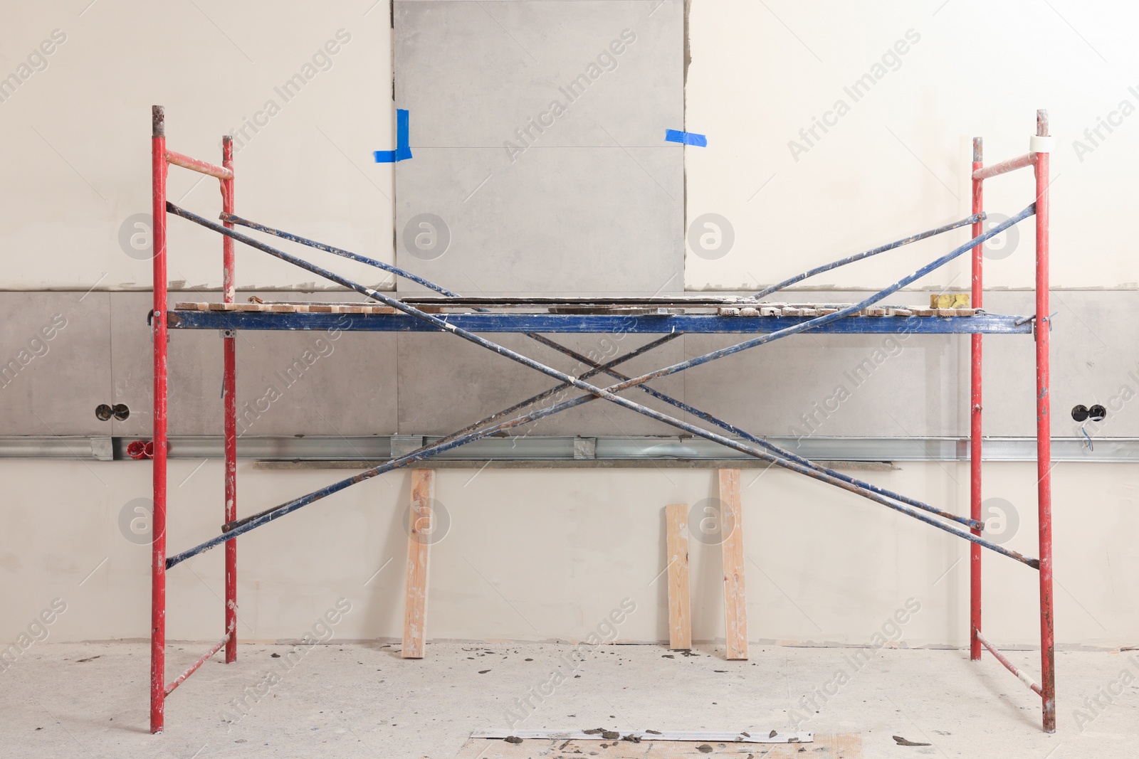 Photo of Tower tour near wall with adhesive mix and tiles indoors