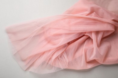 Beautiful tulle fabric on light grey background, top view