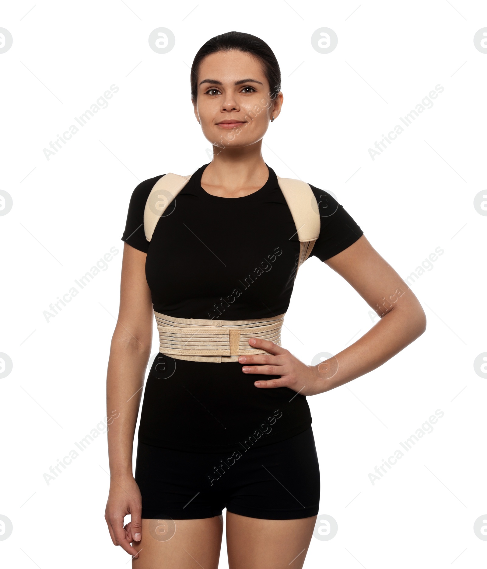 Photo of Beautiful woman with orthopedic corset on white background