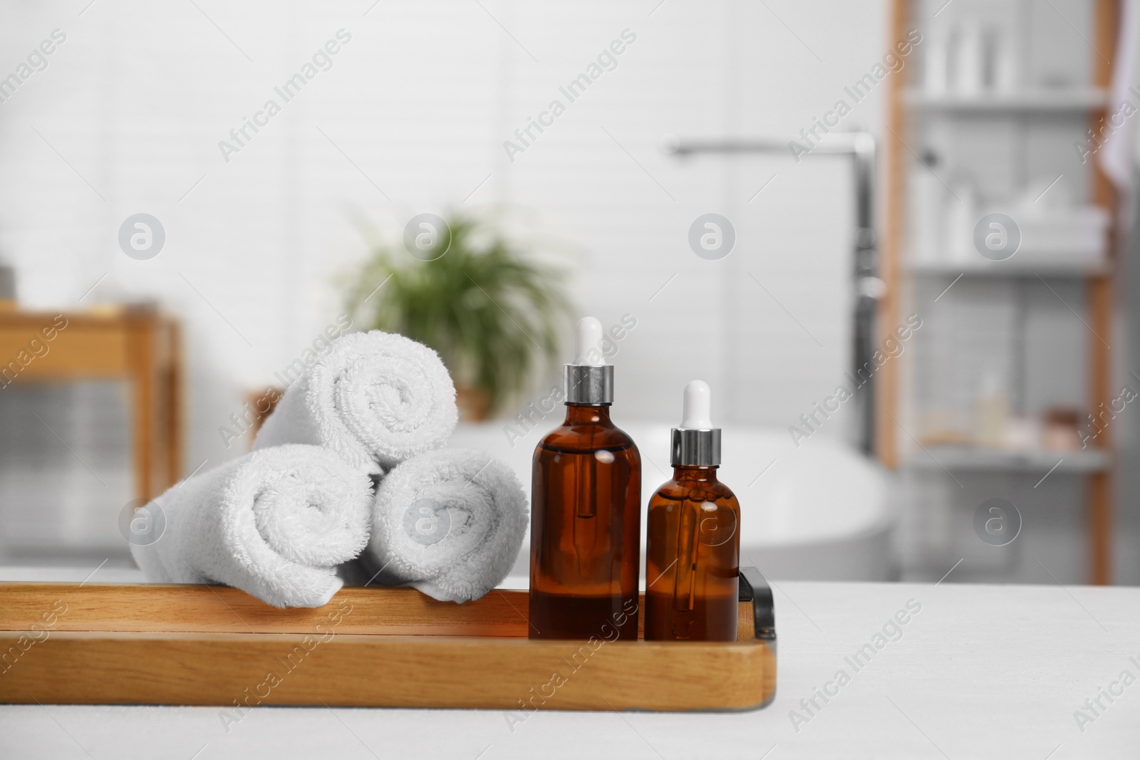 Photo of Composition with spa products on white table in bathroom