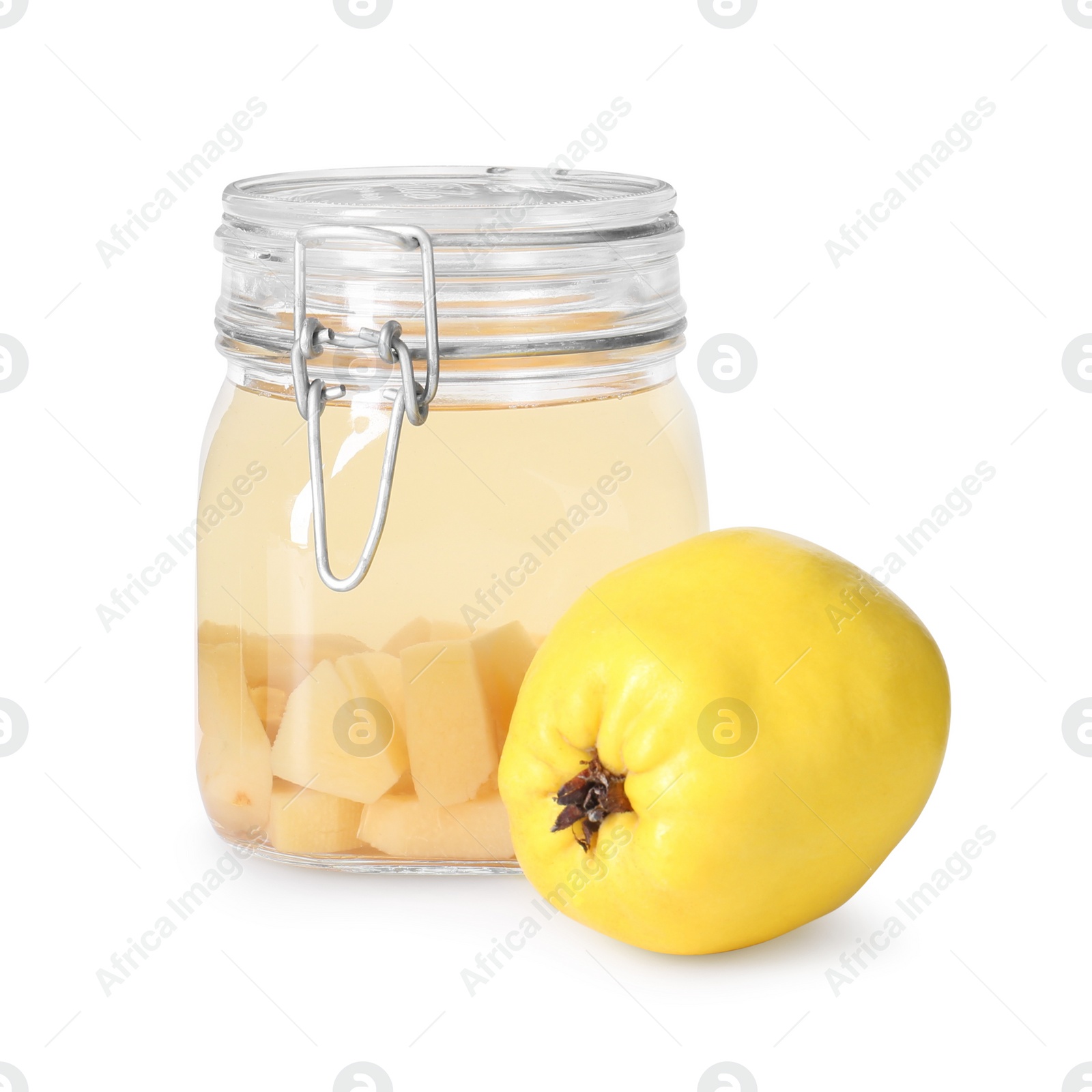 Photo of Delicious quince drink in glass jar and fresh fruit isolated on white