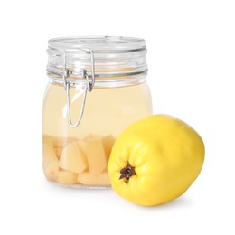 Delicious quince drink in glass jar and fresh fruit isolated on white