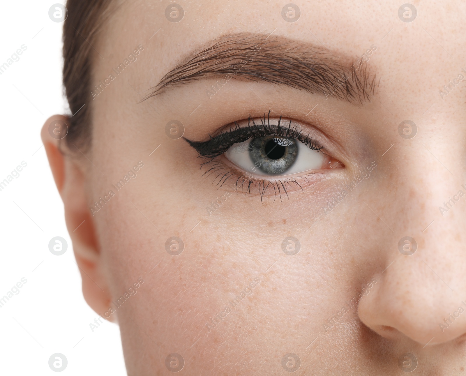 Photo of Makeup product. Woman with black eyeliner and beautiful eyebrow on white background, closeup