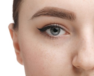 Makeup product. Woman with black eyeliner and beautiful eyebrow on white background, closeup