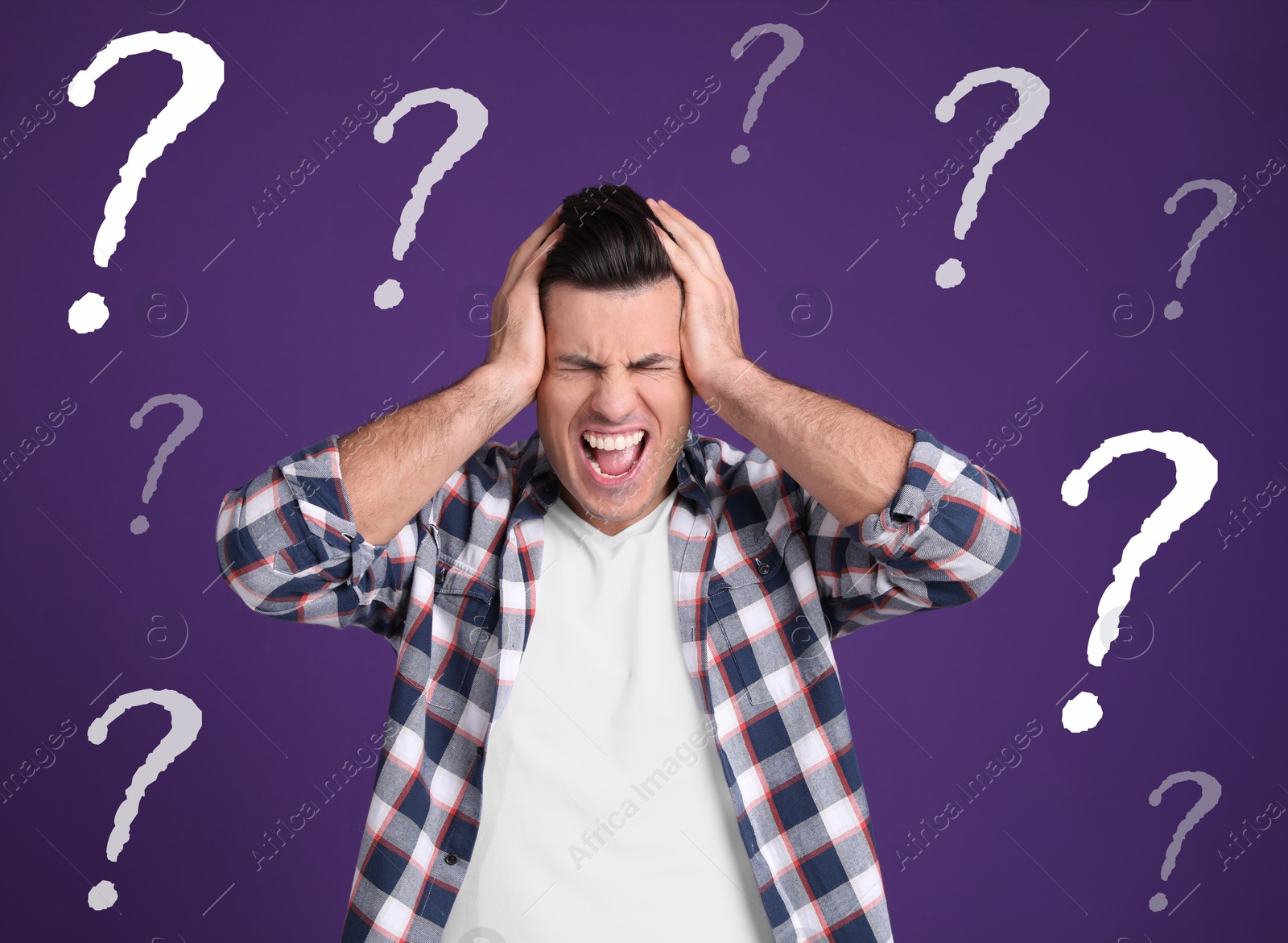 Image of Amnesia. Stressed man and question marks on purple background