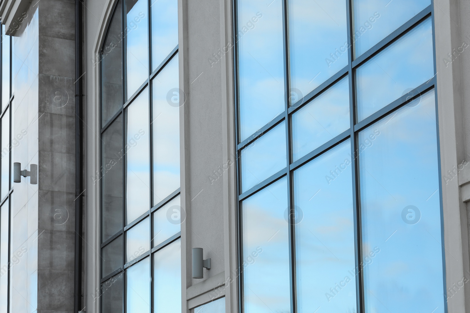 Photo of New modern building with tinted windows outdoors