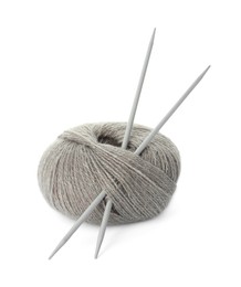 Photo of Grey woolen knitting yarn and needles on white background