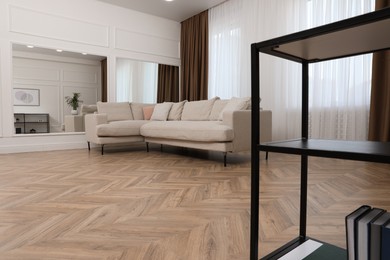 Modern living room with parquet flooring and stylish furniture