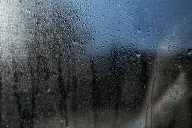 Photo of Rain drops on window glass as background