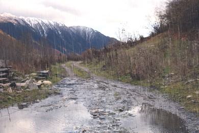 Image of Picturesque view of river in mountains on rainy day