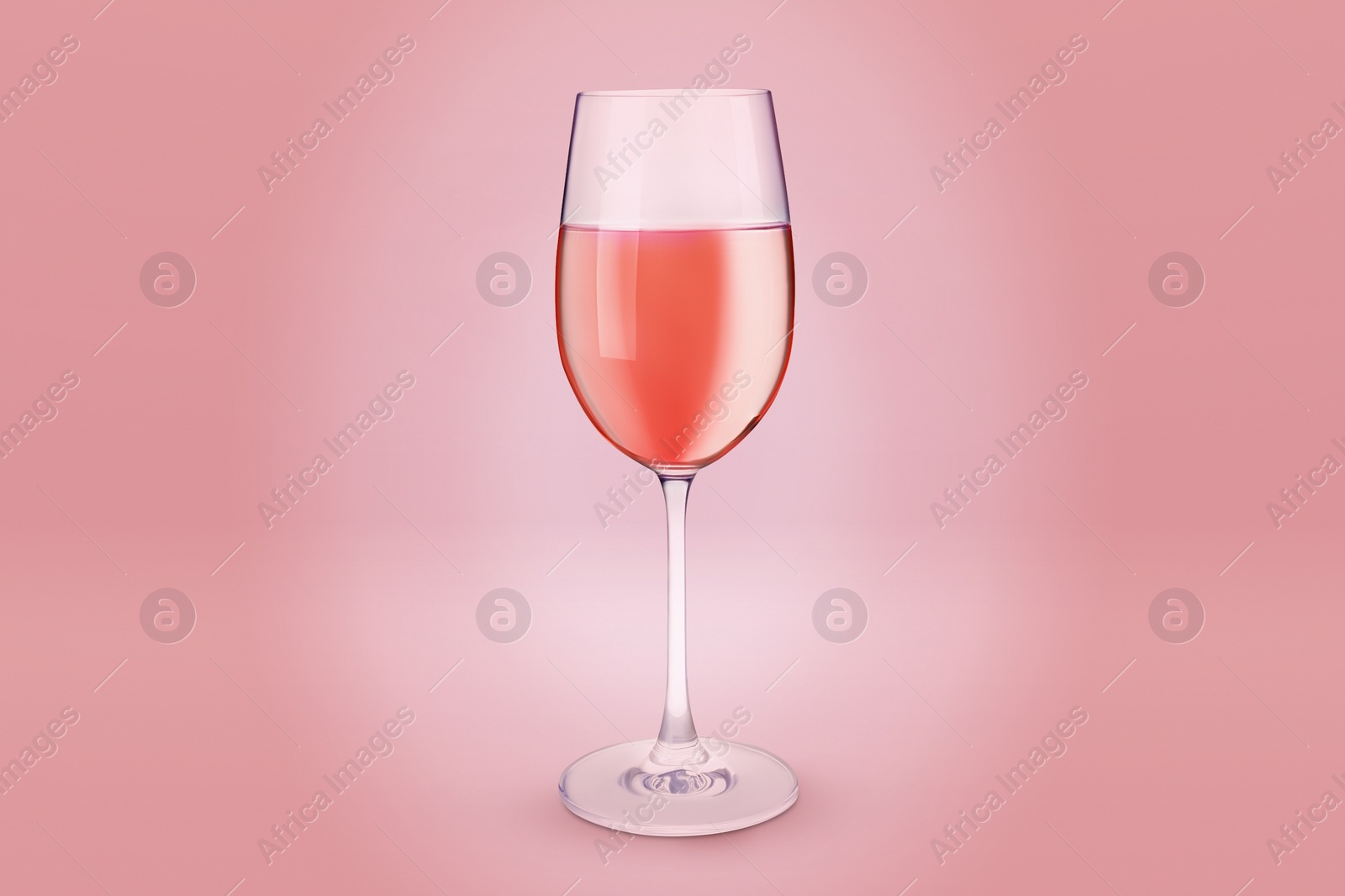 Image of Glass of expensive rose wine on pink background