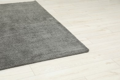 Soft grey carpet on white laminated floor indoors