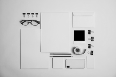 Photo of Flat lay composition with stationery on light background. Mock up for design