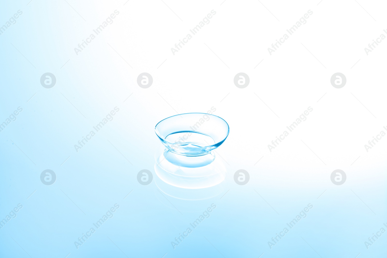 Photo of Contact lens on color glass background