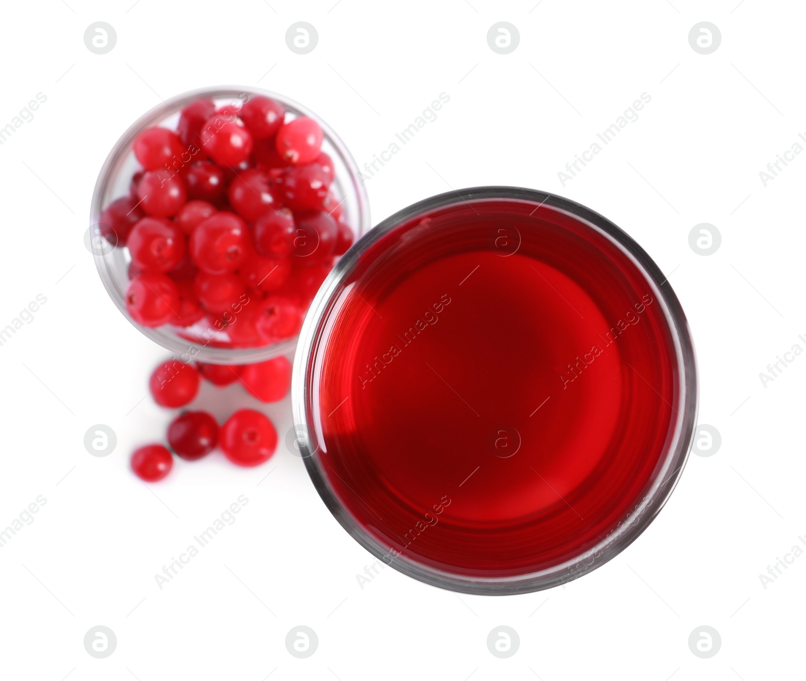 Photo of Tasty cranberry juice in glass and fresh berries isolated on white, top view