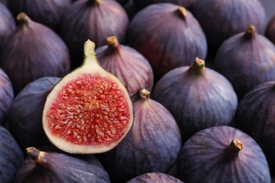 Fresh ripe figs as background, top view. Tropical fruit