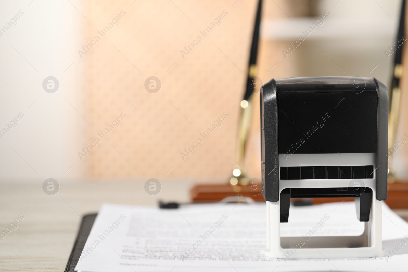 Photo of Notary contract. Stamp and document on table, closeup. Space for text