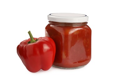 Photo of Glass jar of delicious canned lecho and fresh bell pepper on white background