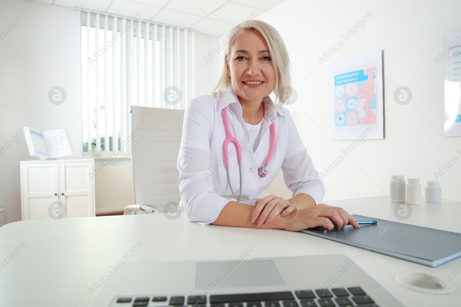 Photo of Doctor consulting patient using video chat in clinic, view from web camera