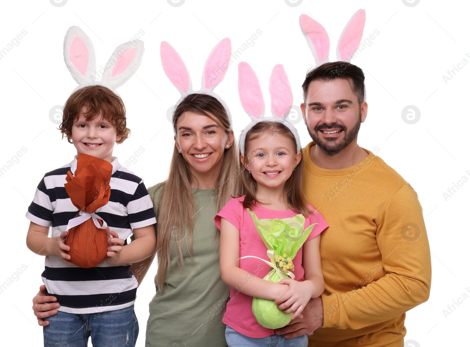 Photo of Easter celebration. Happy family with bunny ears and wrapped eggs isolated on white