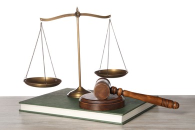 Law concept. Gavel, scales of justice and book on wooden table against white background