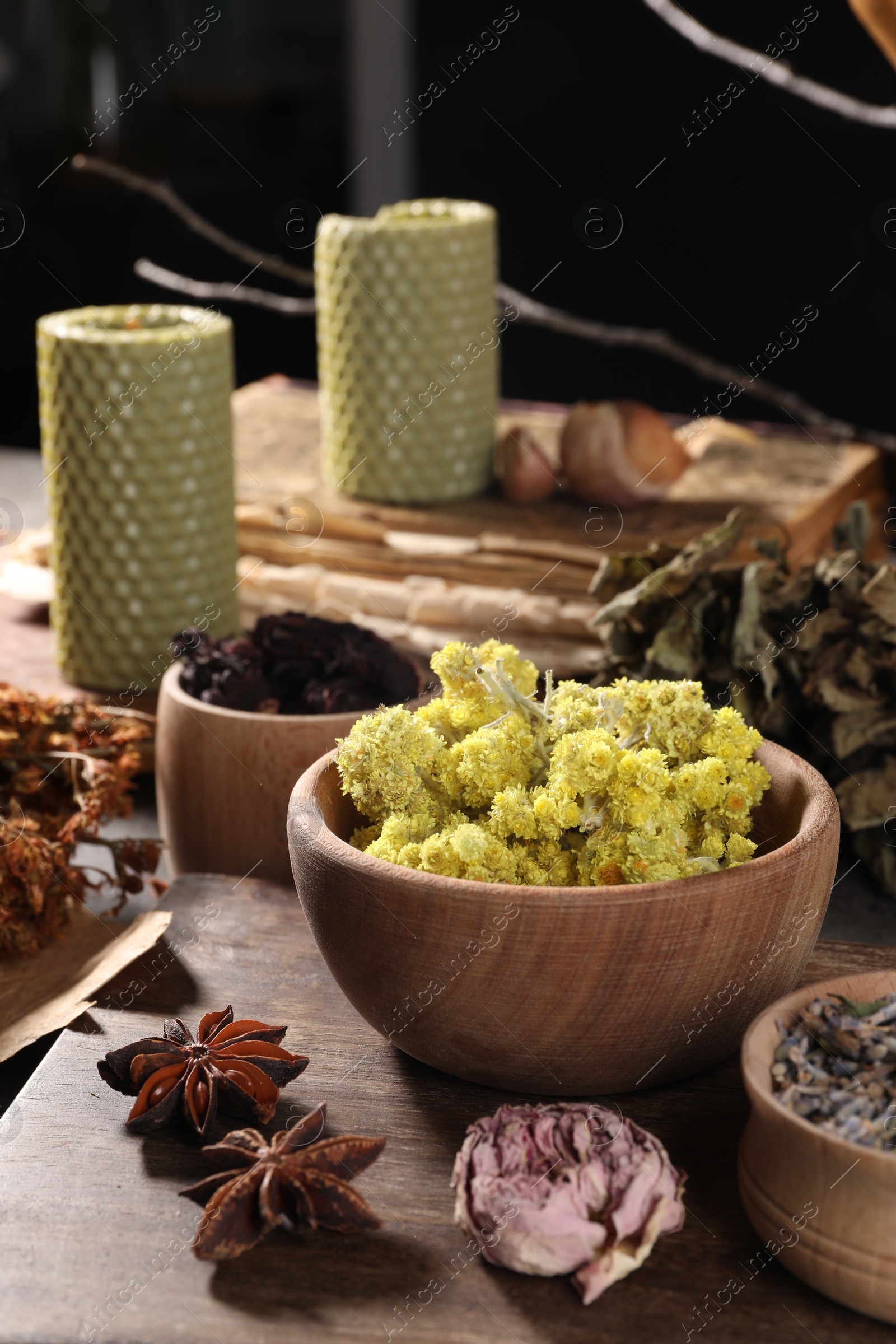 Photo of Many different dry herbs, flowers and anise stars on table