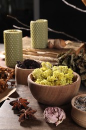 Many different dry herbs, flowers and anise stars on table