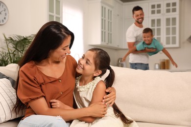Photo of Happy family with children having fun at home