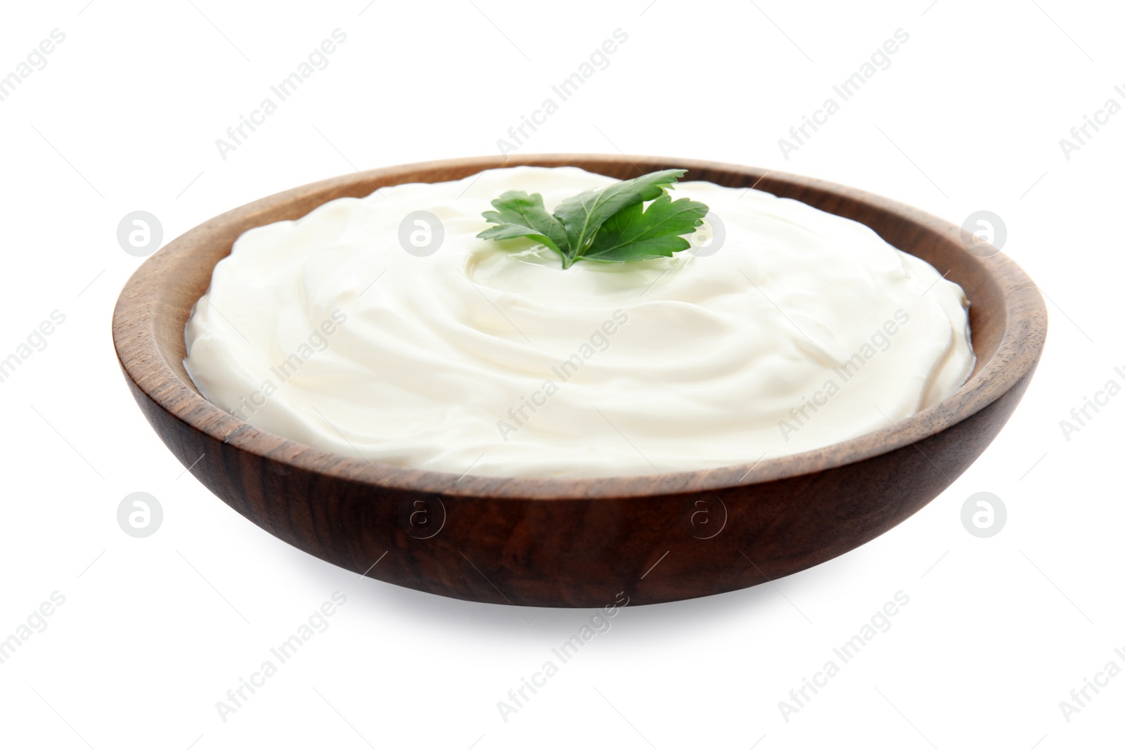 Photo of Bowl with sour cream and herbs on white background