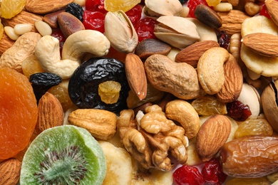 Different dried fruits and nuts as background, closeup