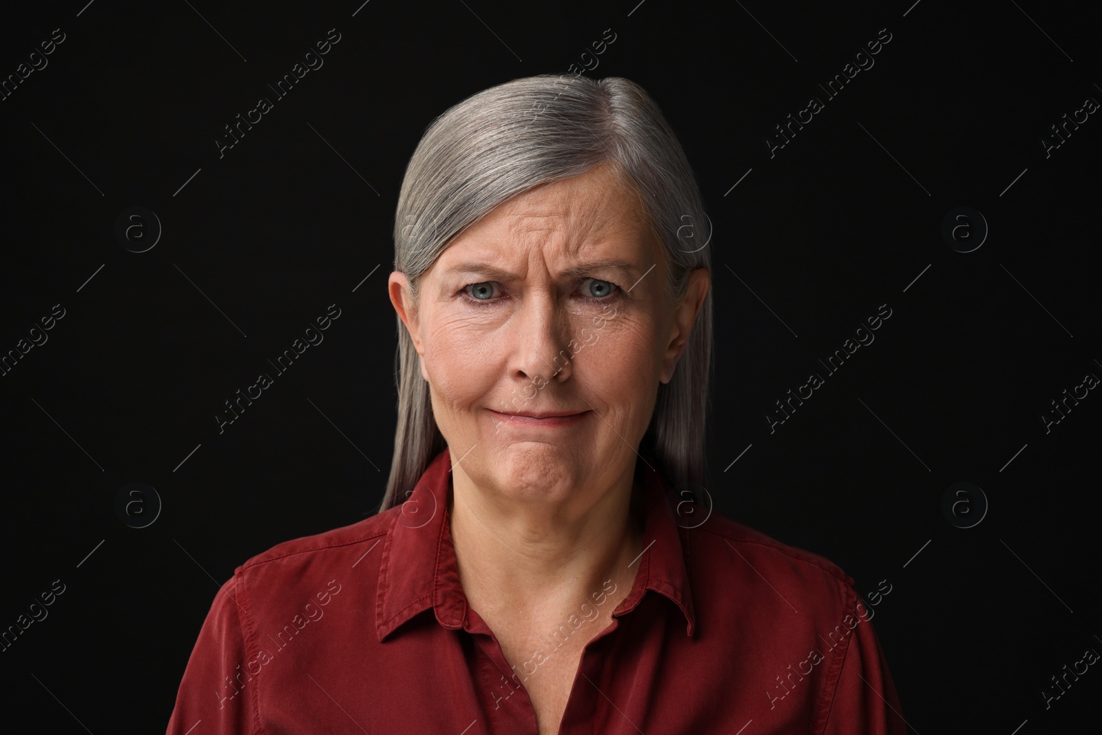 Photo of Personality concept. Portrait of emotional woman on black background