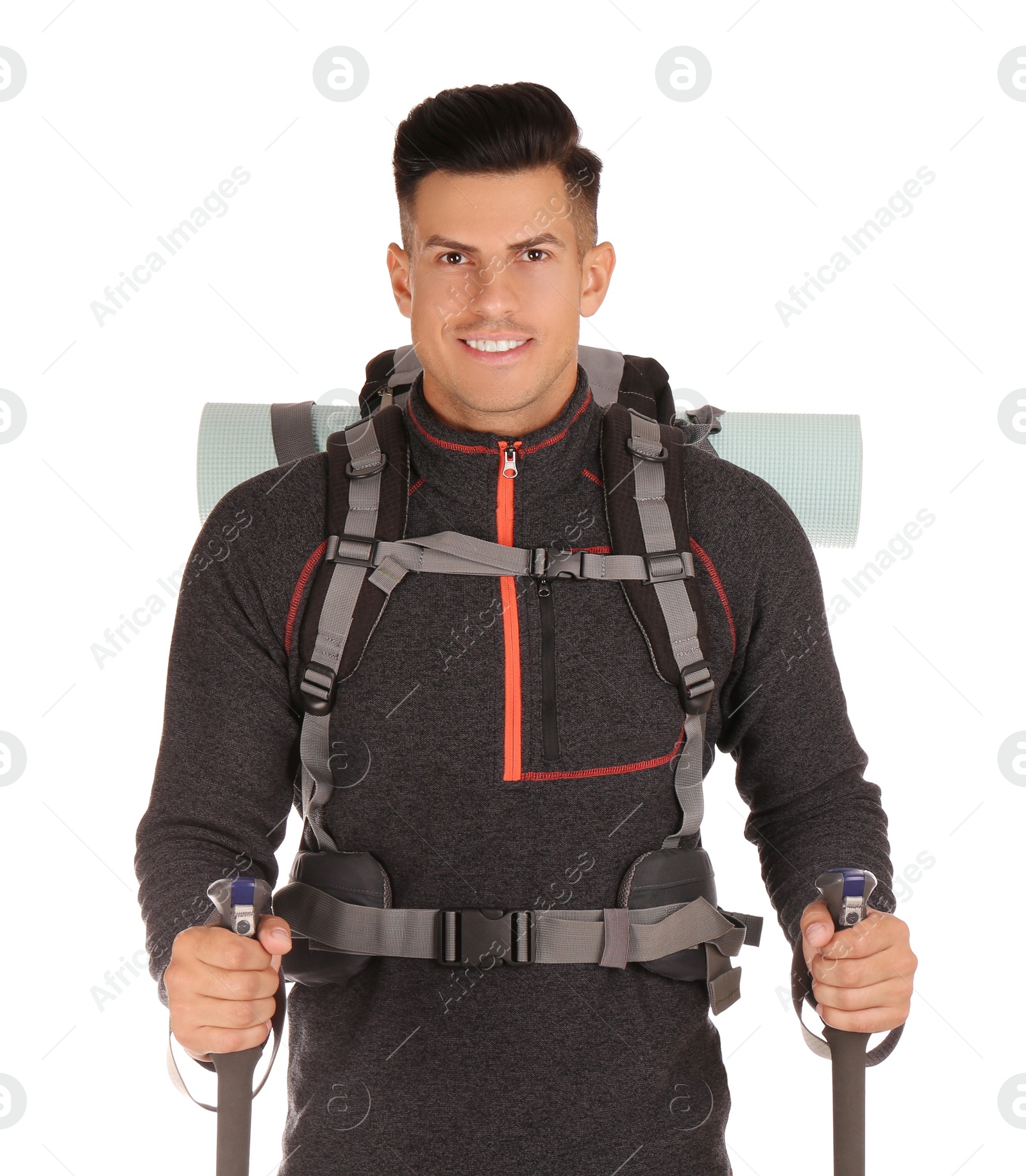 Photo of Male hiker with backpack and trekking poles on white background