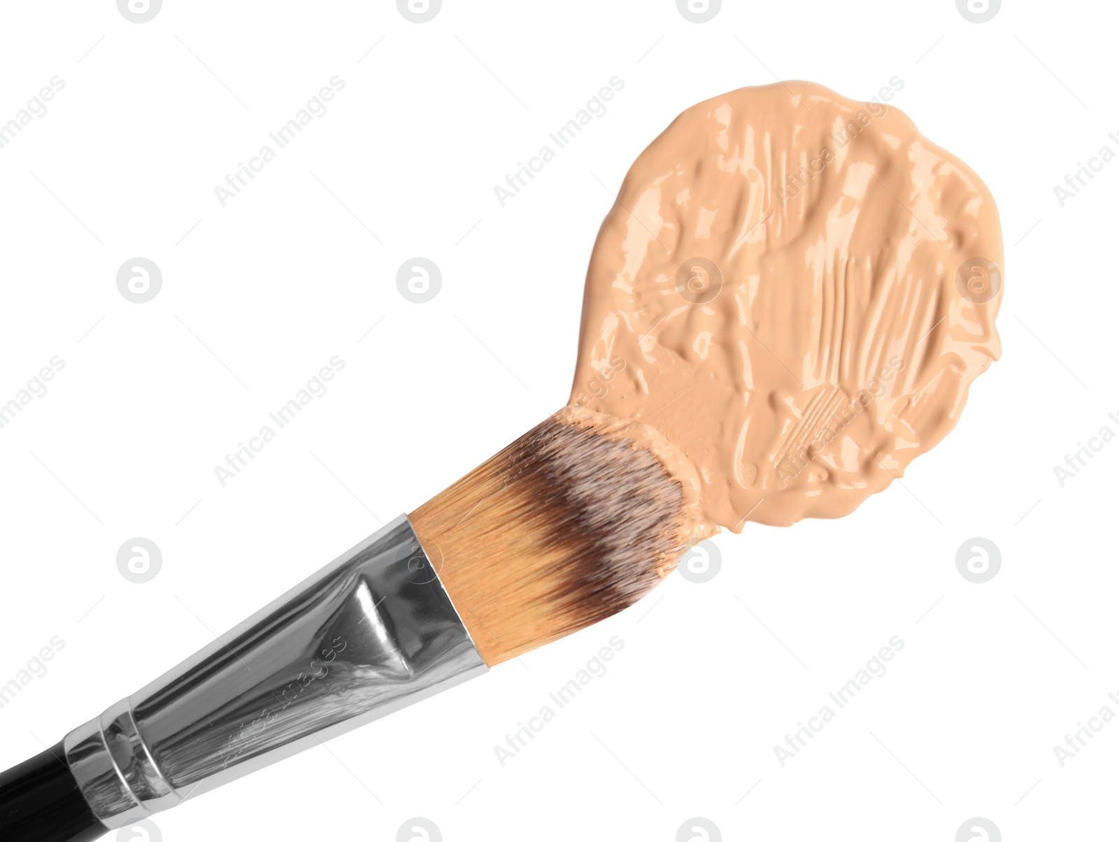 Photo of Sample of liquid foundation and makeup brush on white background, top view