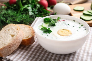 Photo of Delicious cold summer soup with kefir served on table