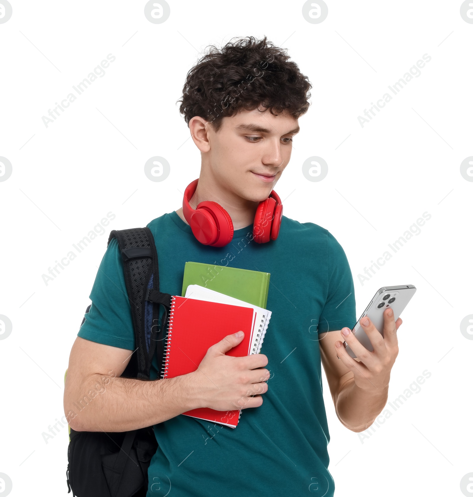 Photo of Portrait of student with backpack, notebooks, smartphone and headphones on white background
