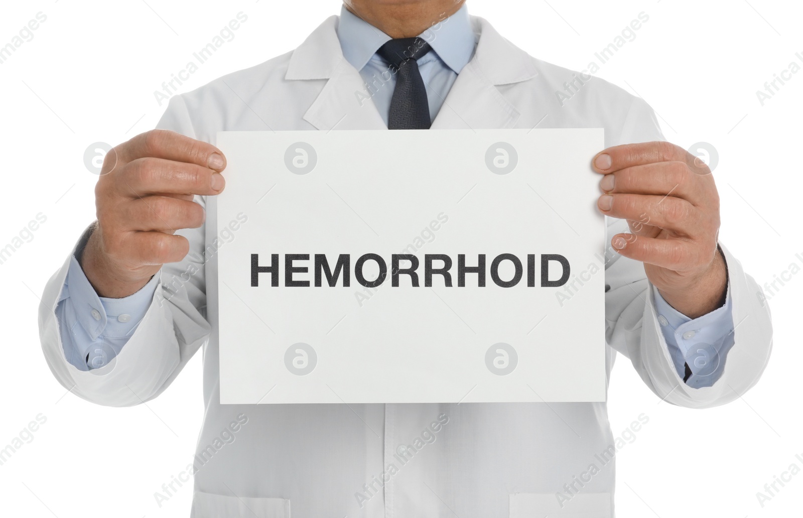 Photo of Doctor holding sign with word HEMORRHOID on white background, closeup