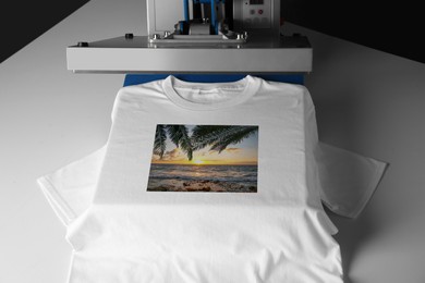 Custom t-shirt. Using heat press to print beautiful image of tropical seascape