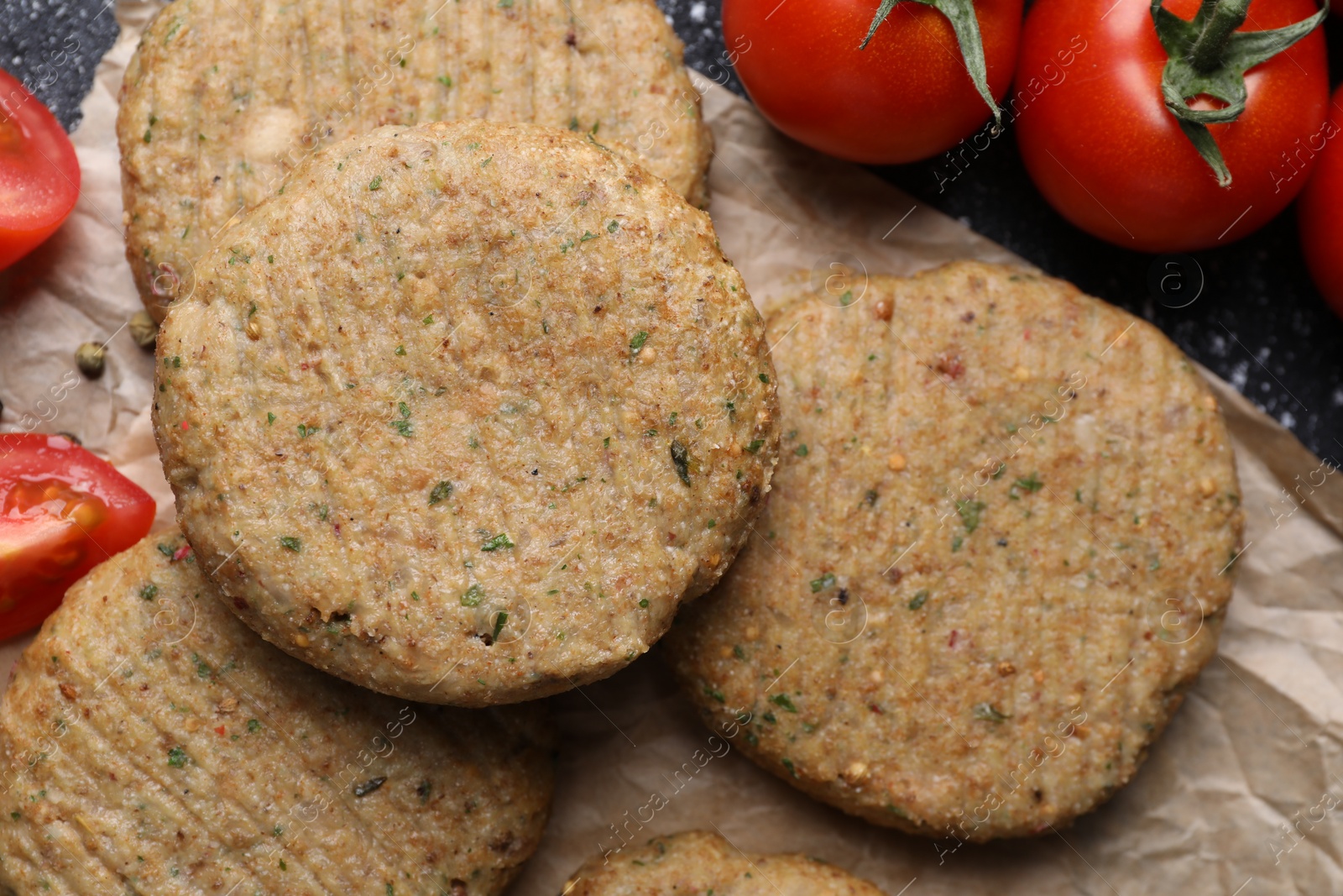 Photo of Tasty vegan cutlets and products on table, top view