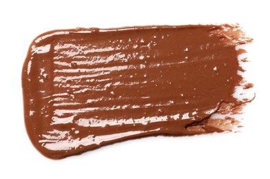 Photo of Smear of tasty milk chocolate paste isolated on white, top view