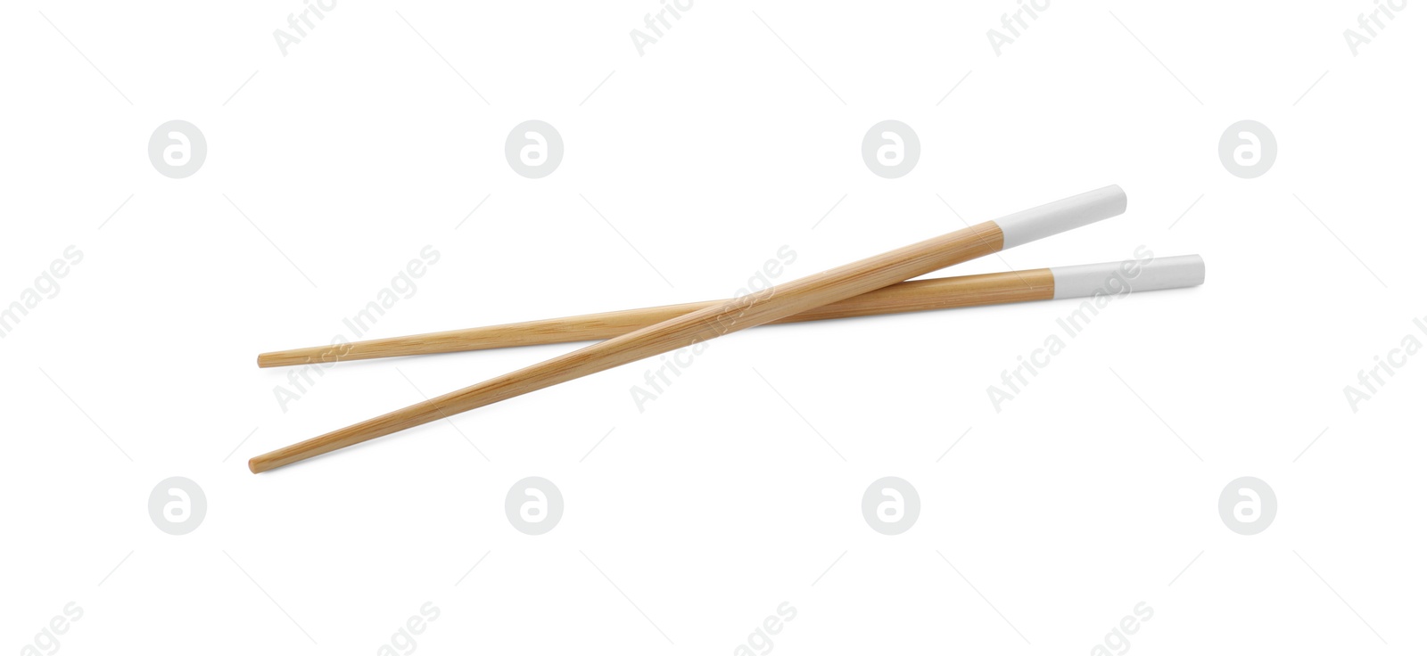 Photo of Pair of wooden chopsticks isolated on white