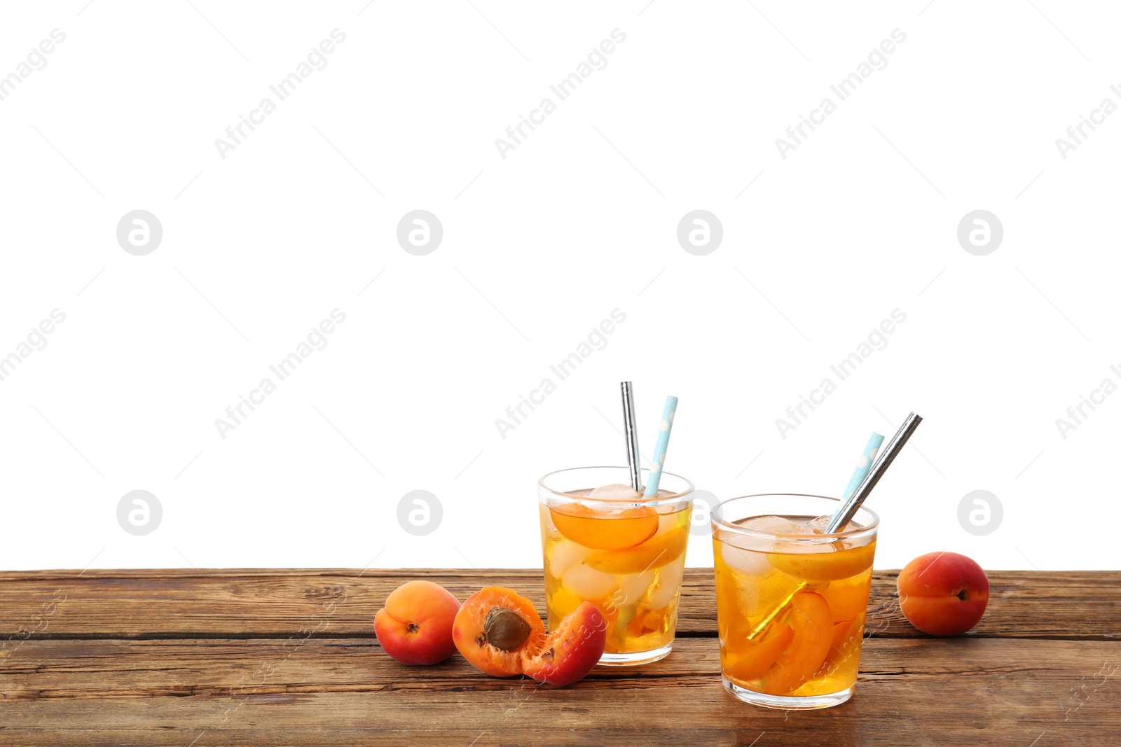 Photo of Delicious refreshing drink with apricot on wooden table against white background. Space for text