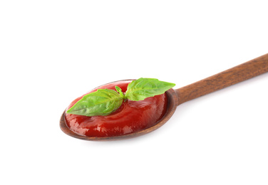 Photo of Tasty tomato sauce in spoon isolated on white