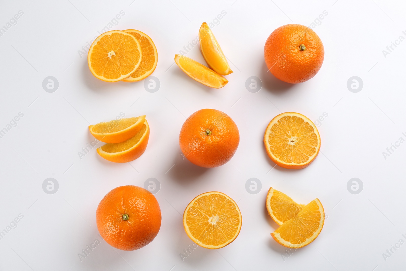 Photo of Delicious oranges on white background, flat lay
