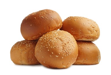 Photo of Stack of fresh tasty buns with sesame seeds isolated on white