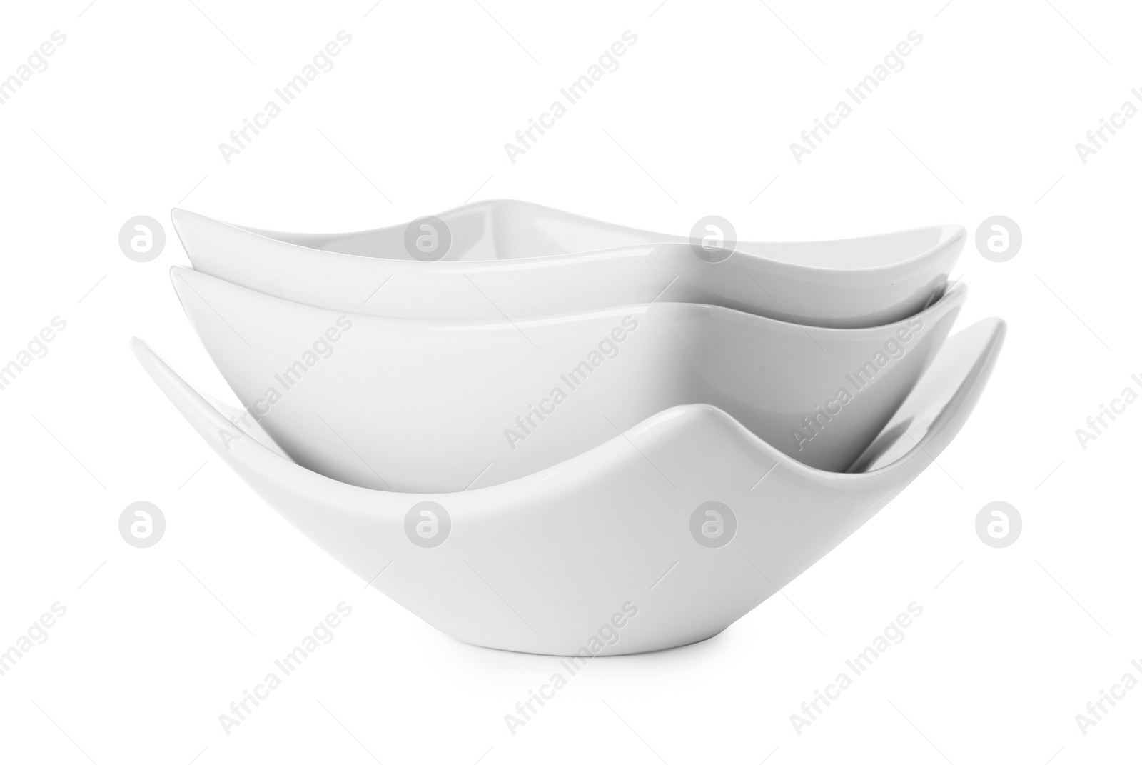 Photo of Stack of clean bowls isolated on white